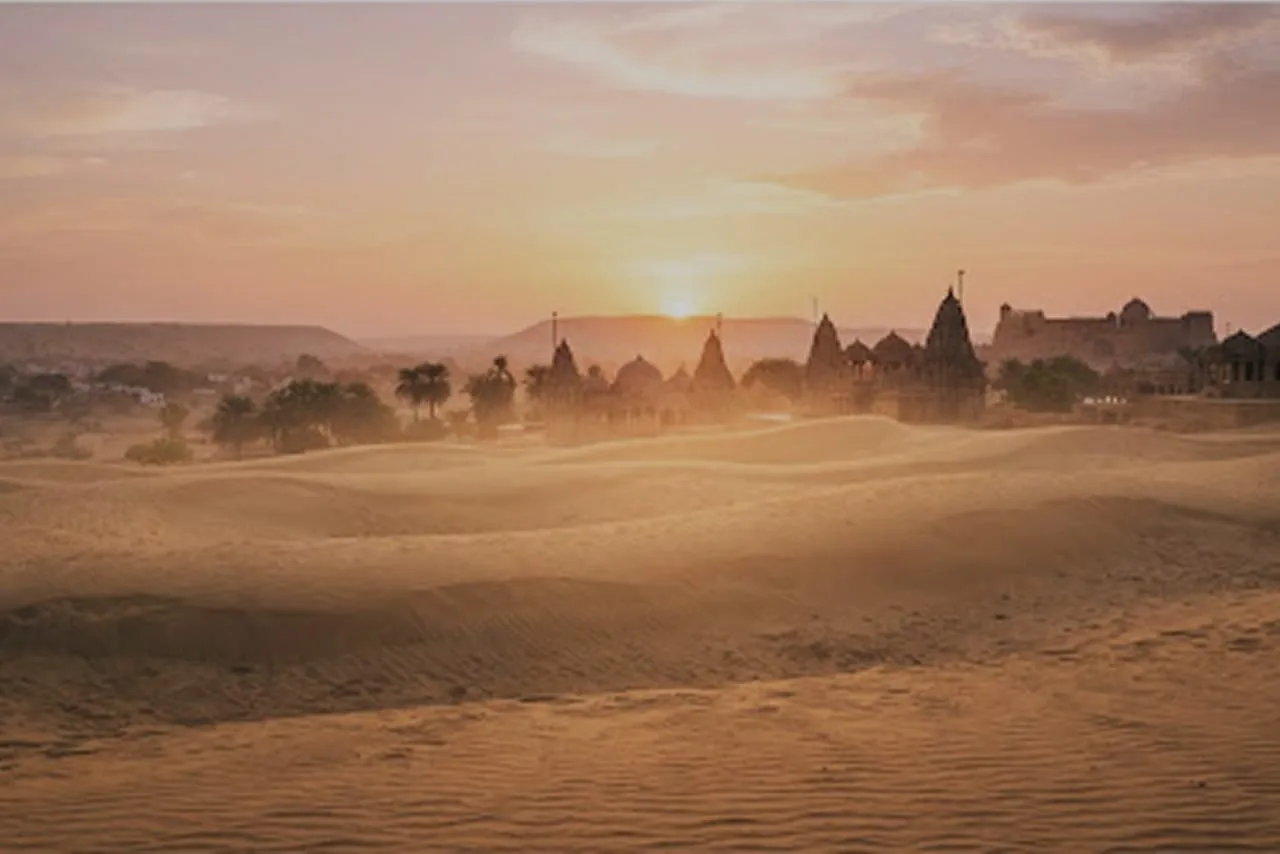 Ancient desert temple silhouettes in Rajasthan during sunset, chronicled in Whispers of India