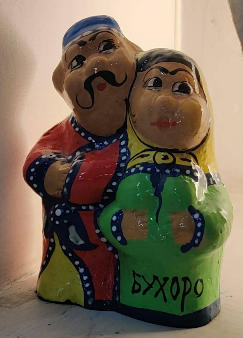 Quaint traditional ceramic Babaychik dolls representing elders in Bukhara