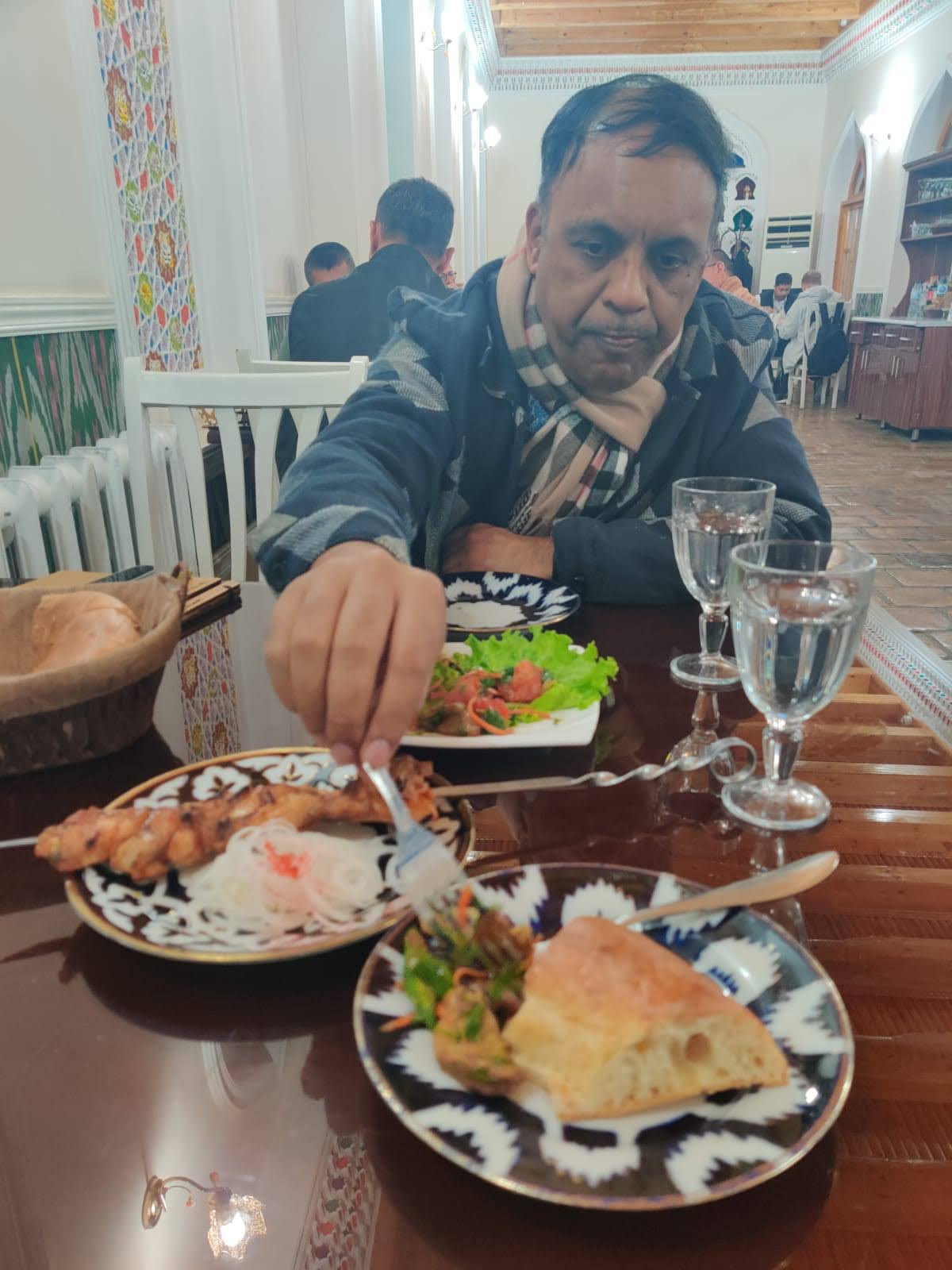Delicious grilled Shashlik skewers served alongside traditional Uzbek flatbread