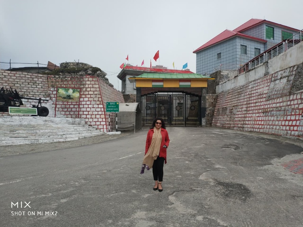 Traveler standing in front of historic Nathula Border Gate at India-China border