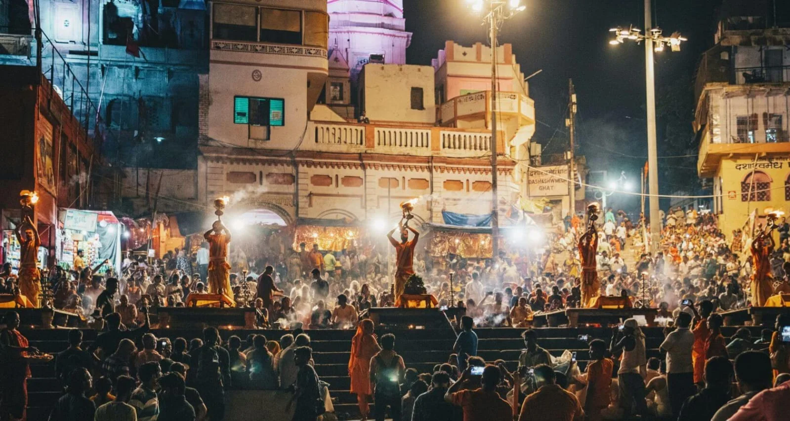 Pilgrims performing rituals at a historical temple pool along the ghats