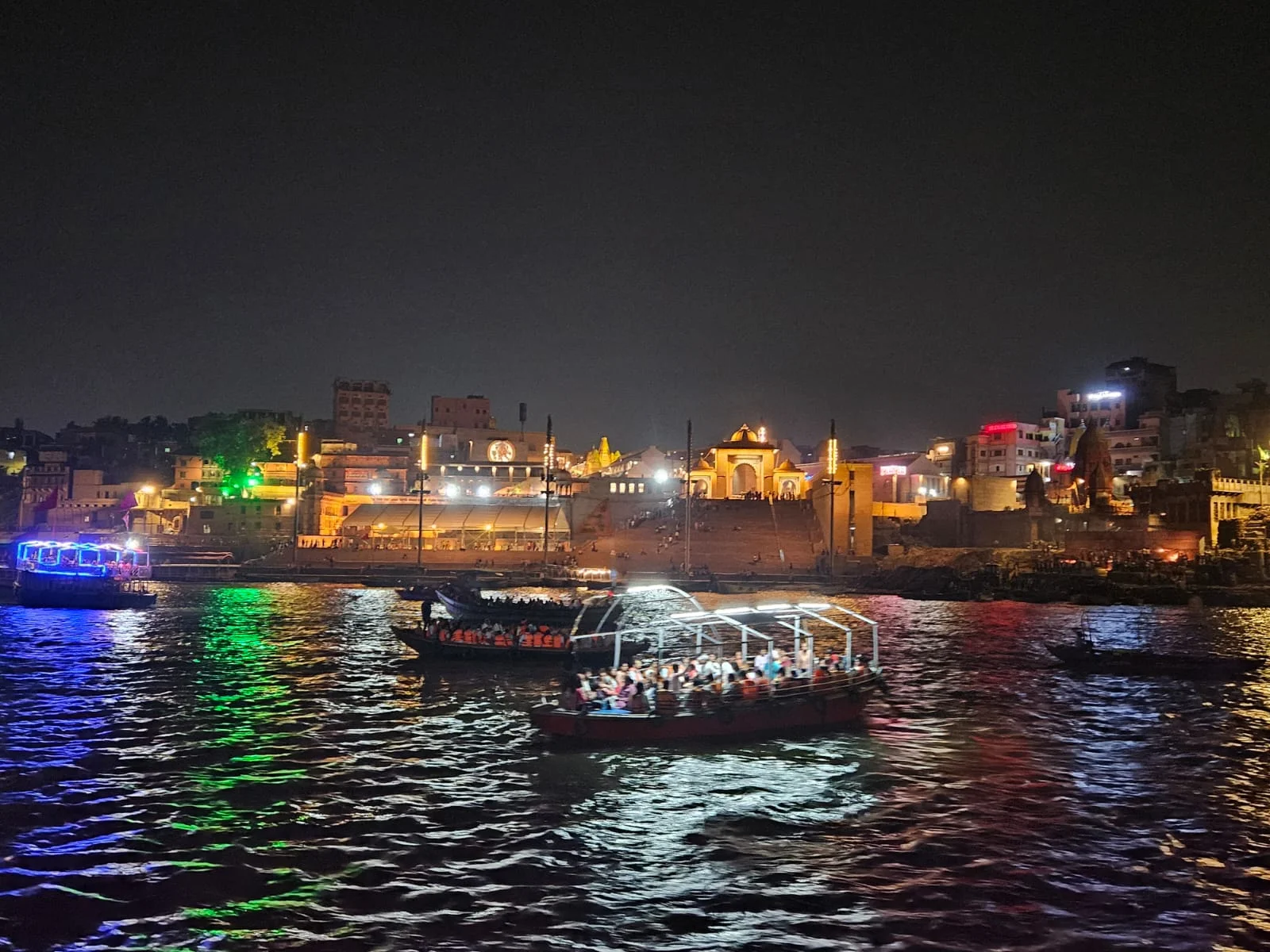 Scenic overview of the ghats and traditional wooden boats along the Ganga