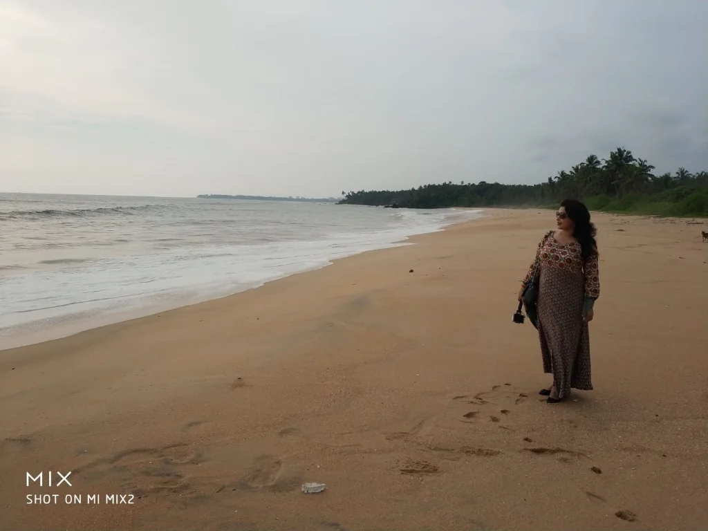 Secluded beach view looking towards calm sea at Thottada Beach