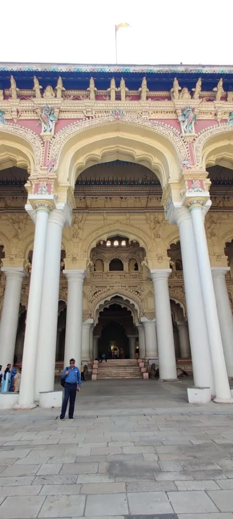 Colossal white entrance pillars and grand arches of Thirumalai Nayakkar Mahal