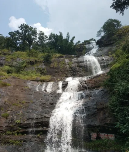 Scenic view of seven-step Cheeyappara Waterfalls cascading down rock face