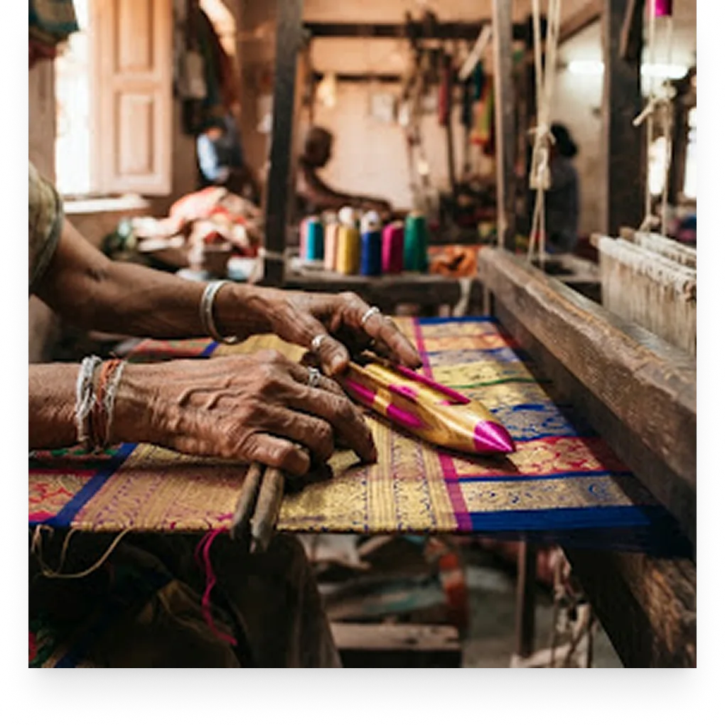 Artisan weaving silk by hand on a traditional loom in Varanasi